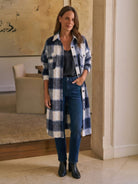 Oversized medium-length blue plaid overshirt in wool-blend fabric with functional pockets and relaxed fit