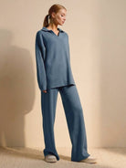 woman wearing plush and preppy camel two-piece set in soft blue with polo collar pullover and wide-leg pants