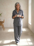 Woman wearing relaxed shirt and loose trousers two-piece set in monochrome style