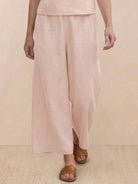 Woman wearing The Meadow loose fit co-ord set with soft-tailored top and wide-leg bottoms in solid color