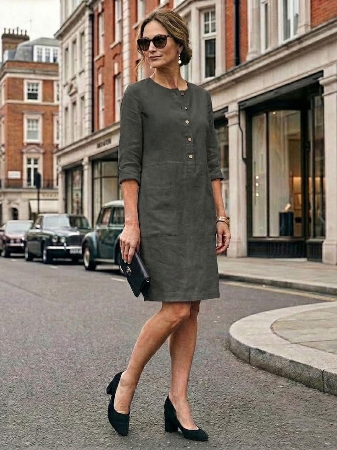 Elegant knee-length cotton dress with 3/4 rolled sleeves and button details, perfect for summer and casual wear.