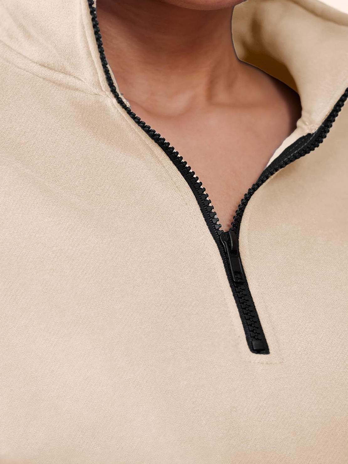 Close-up of beige ultra-soft and comfy co-ord tracksuit set with black zipper detail