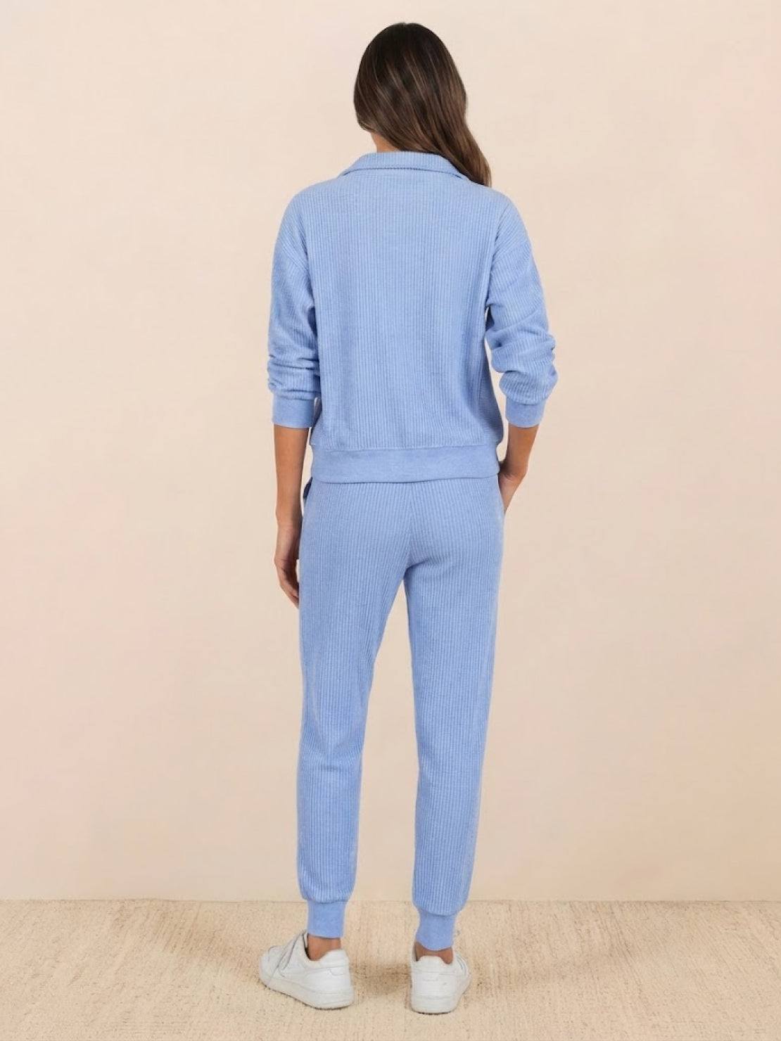 Unisex half-zip pullover and sweatpants set in relaxed fit for casual comfort and everyday wear