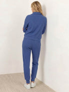 Unisex half-zip pullover and matching sweatpants set in soft fabric for casual and travel wear