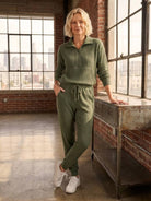 Unisex half-zip pullover and sweatpants set in relaxed fit with soft fabric for casual wear and travel