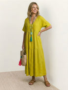 V-neck two-tiered maxi swing dress in flowing tiers with irregular hemline and draped sleeves in 100% cotton