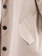 Water-Resistant Oversized Hooded Windbreaker Rain Jacket on mannequin outdoors