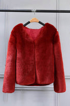 Bold faux fur luxe jacket with V neckline and button closure in deep red